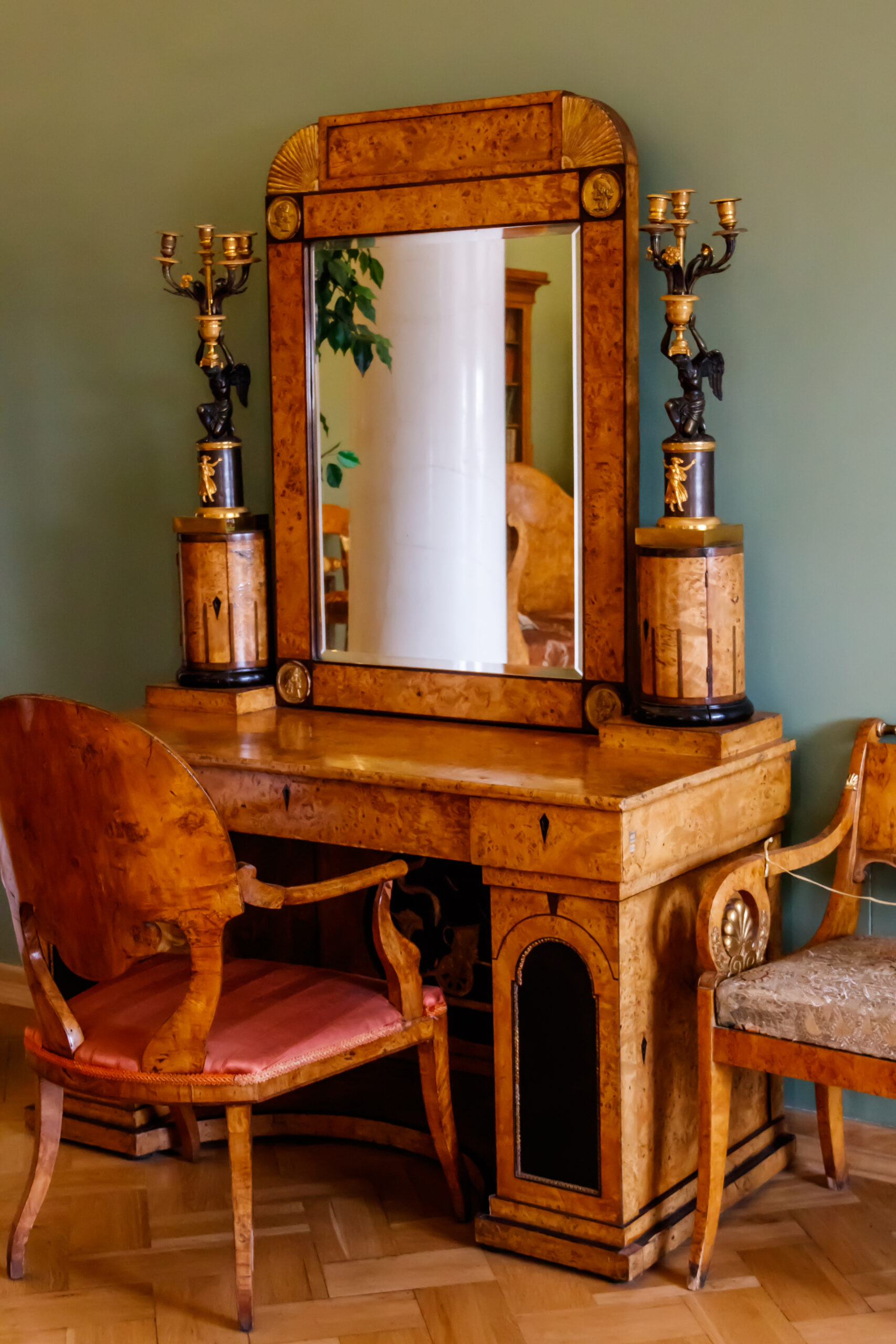 Vintage wooden dressing table with mirror in a room